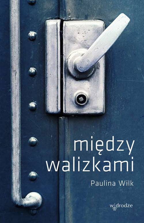 okładka Między walizkami książka | Paulina Wilk